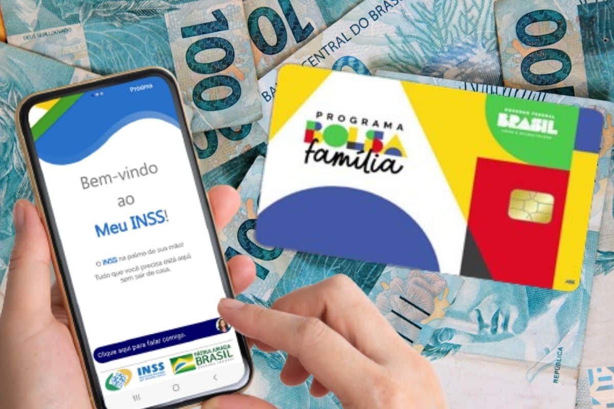 Mão mexendo no aplicativo do INSS, ao lado do cartão do Bolsa Família e cédulas de 100