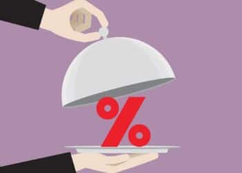 Uma bandeja servindo o símbolo de % (Fonte: Reprodução/Getty Images)