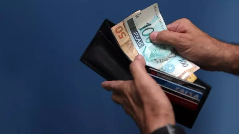 Pagamento abono salarial. (Fonte: Estadão).
