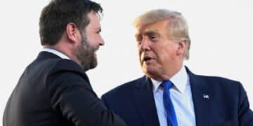 FILE PHOTO: U.S. Senate Republican candidate J.D. Vance, who was endorsed by former U.S. President Donald Trump for the upcoming primary elections, shakes hands with Trump during an event hosted by him, at the county fairgrounds in Delaware, Ohio, U.S., April 23, 2022. REUTERS/Gaelen Morse/File Photo