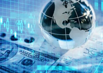 imagem de um globo com dinheiro para falar do mercado financeiro global