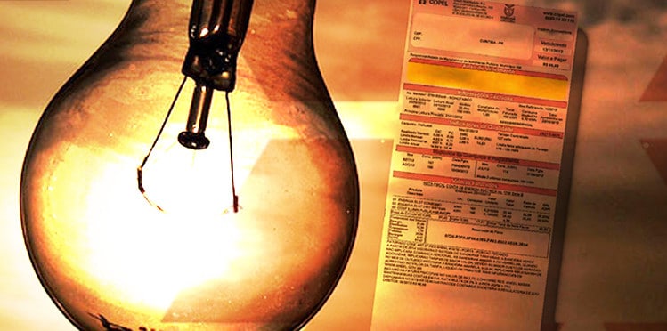 conta de luz ao lado de uma lâmpada