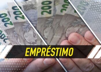 imagem de notas de dinheiro de duzentos reais seguradas por mãos e com uma faixa preta escrito empréstimo