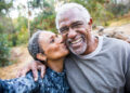 A beautiful senior African American Couple takes a selfie during their workout